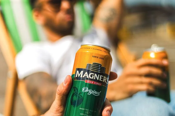 Magners can in hand